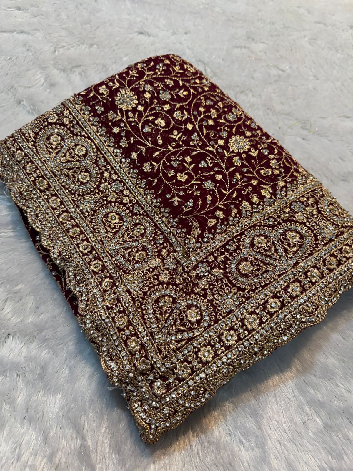Ultra Luxury Maroon Soft Georgette Saree with Diamond Stone Work and Flowery Gold Zari Embroidery Work (SC34114)