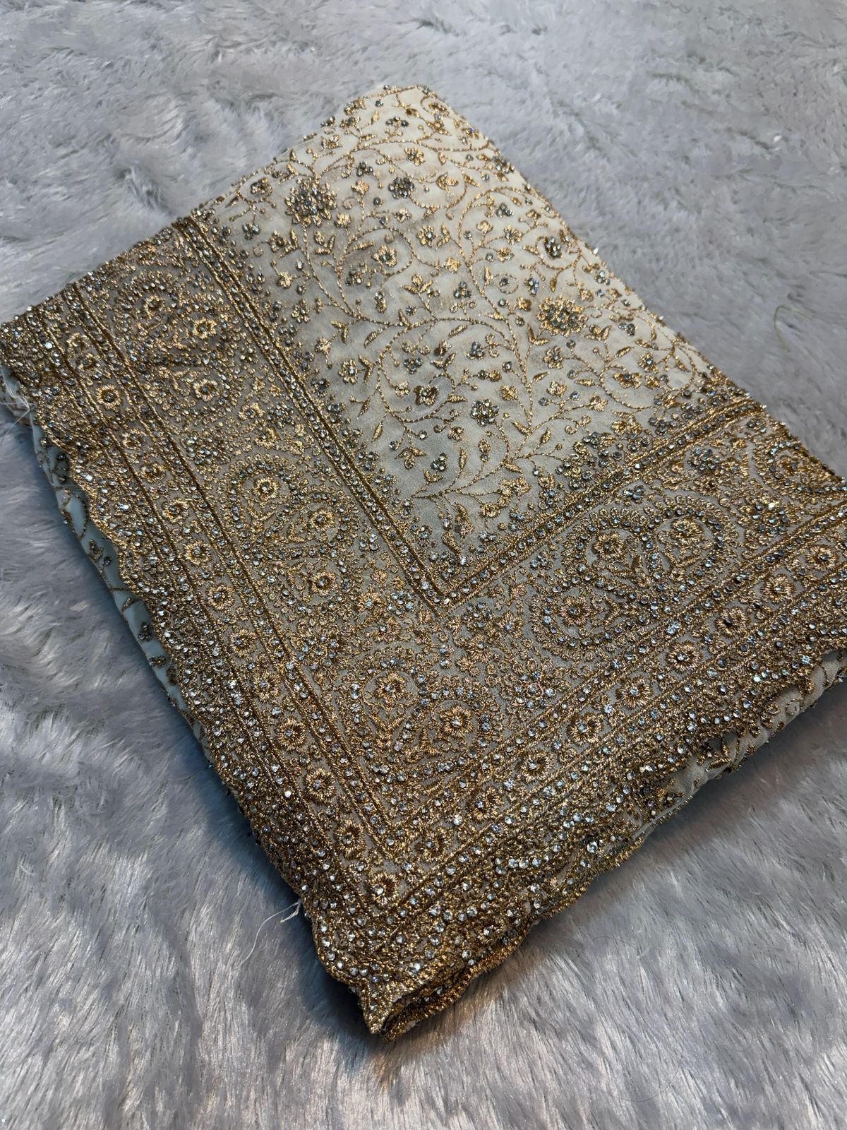 Ultra Luxury Ivory Soft Georgette Saree with Diamond Stone Work and Flowery Gold Zari Embroidery Work (SC34111)