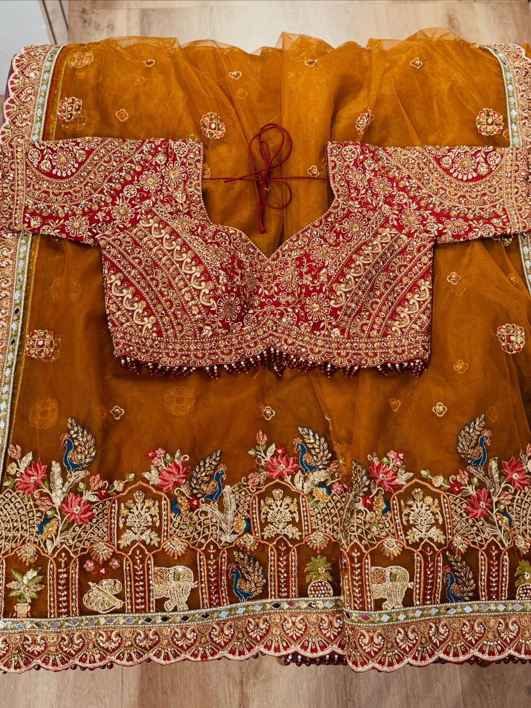 Rajwadi Luxury Cinnamon Net Saree with zari, sequins and stone work, intricately woven into rich motifs and Fully Stitched Readymade Embroidered Blouse (SC77555) - Image 2