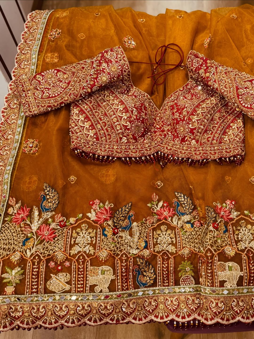 Rajwadi Luxury Cinnamon Net Saree with zari, sequins and stone work, intricately woven into rich motifs and Fully Stitched Readymade Embroidered Blouse (SC77555) - Image 3
